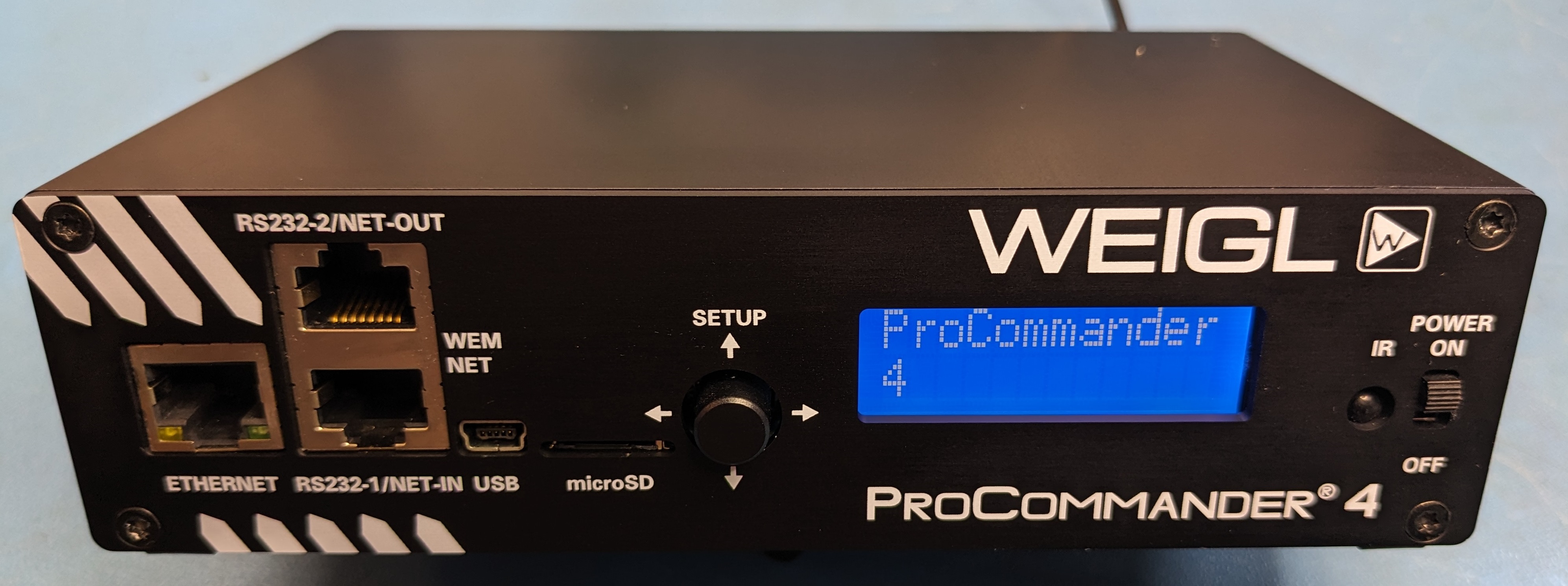 Weigl ProCommander4 animatronic show controller front panel, powered on, displaying firmware version on LCD